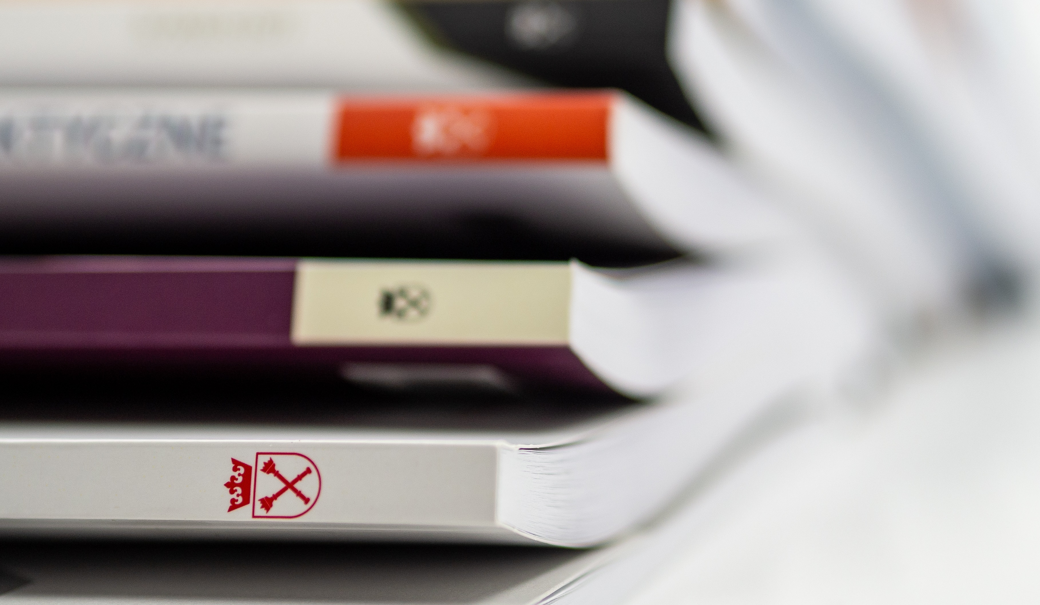Photo of the spines of a stack of journals